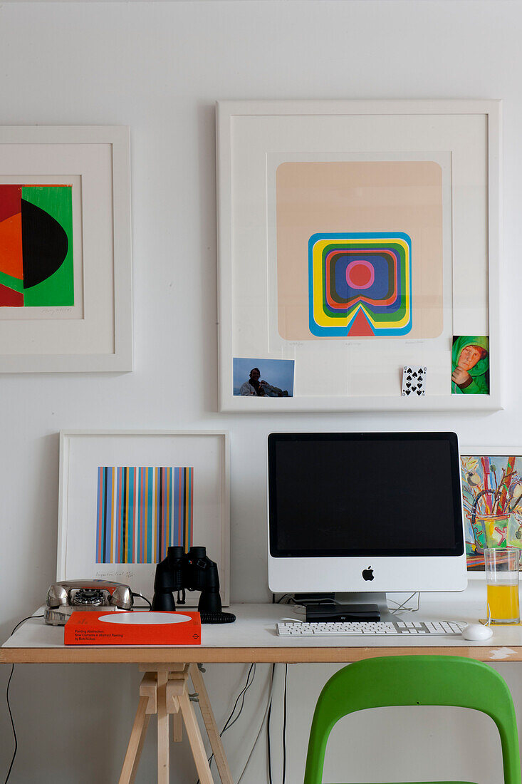 PC screen and modern art in contemporary home office,  Lewes,  East Sussex,  England,  UK