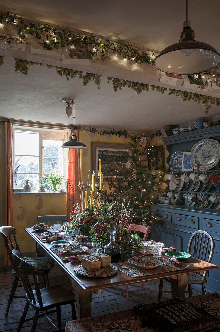 Dining table set for Christmas dinner in Benenden cottage,  Kent,  England,  UK