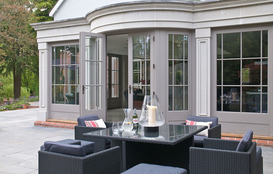 Garden furniture at exterior of contemporary Haywards Heath home,  West Sussex,  England,  UK