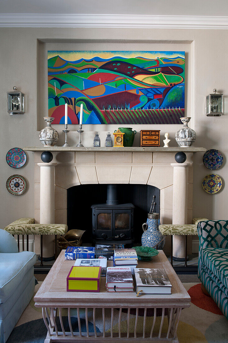 Modern art above fireplace in Tiverton country home,  Devon,  England,  UK