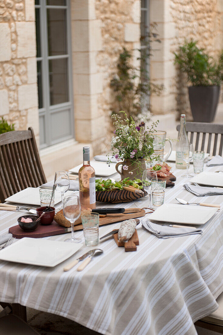 Place settings on table at exterior of Dordogne farmhouse  Perigueux  France