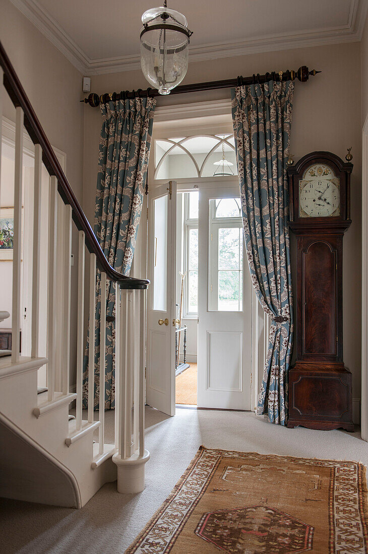 Hallway with door curtains and glass panel doors