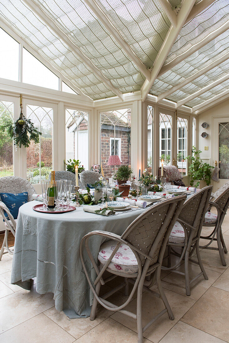 Dining table and chairs set for Christmas dinner in East Sussex coach house  England  UK