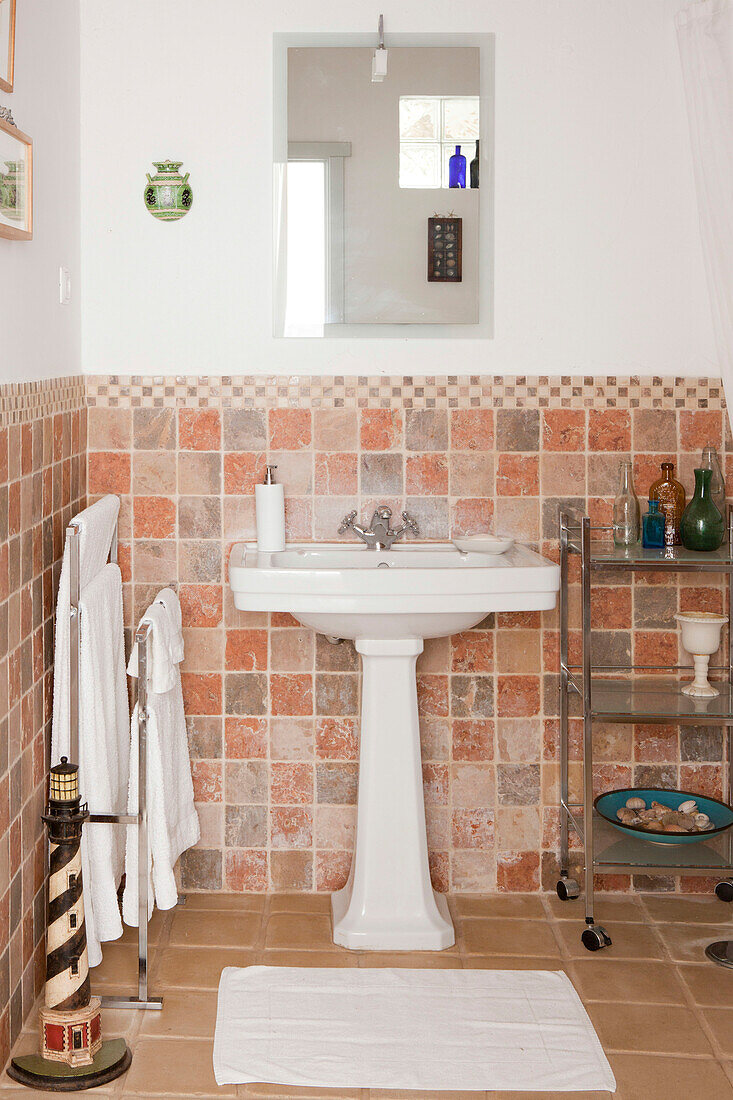 Tiled bathroom with pedestal basin and towel rail, Castro Marim, Portugal