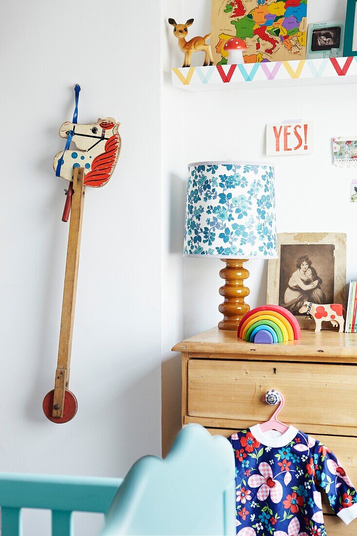Hobby horse and wooden chest of drawers in child's room of London family home,  England,  UK