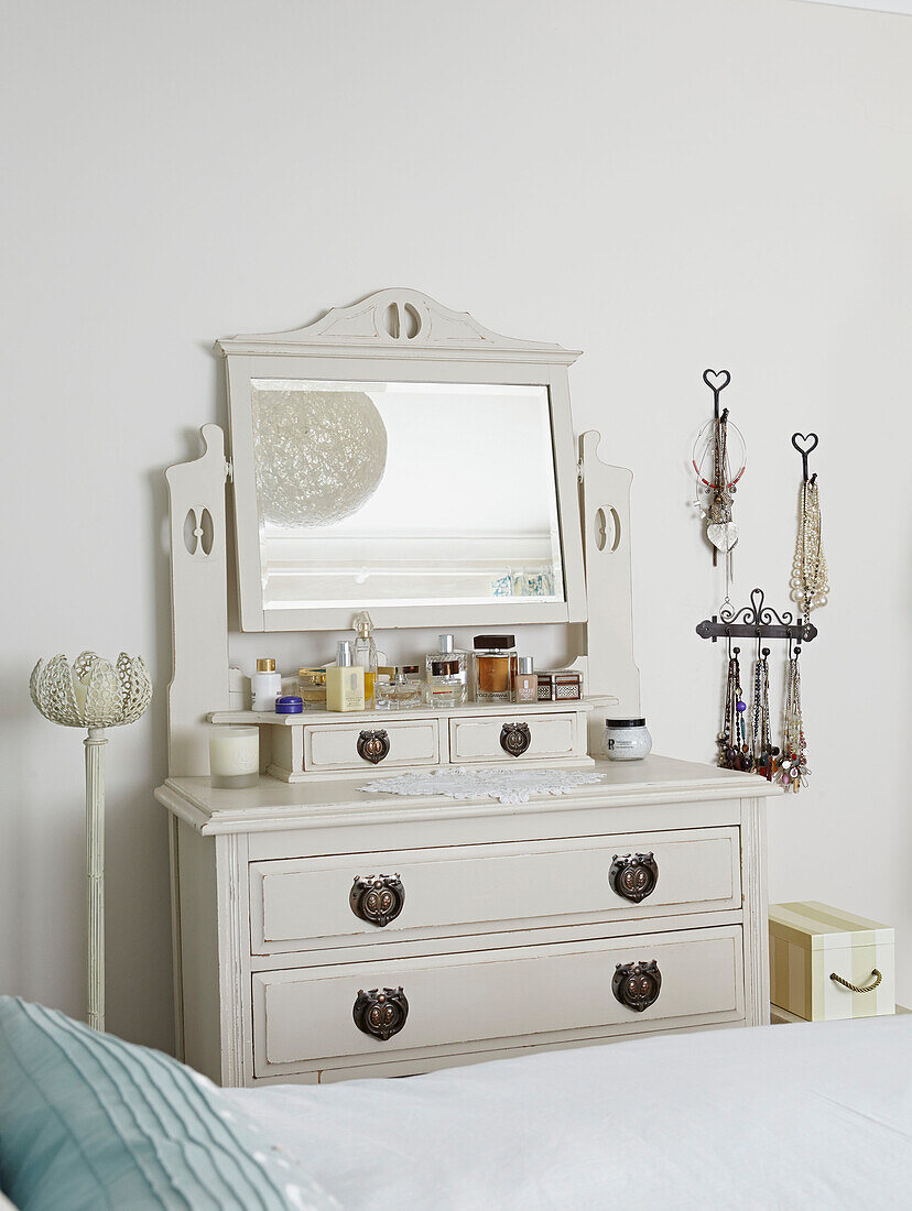 Cream painted dressing table and jewellery in bedroom of Bolton home,  Greater Manchester,  England,  UK