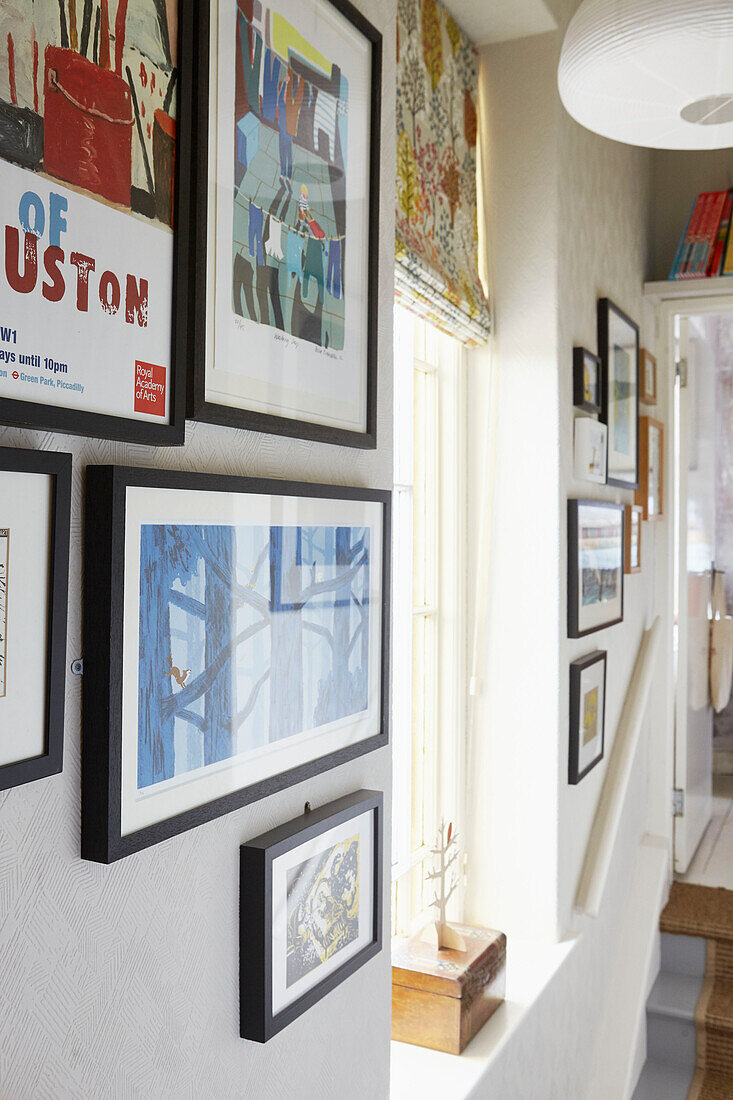 Framed prints in hallway of Berwick Upon Tweed home  Northumberland  UK
