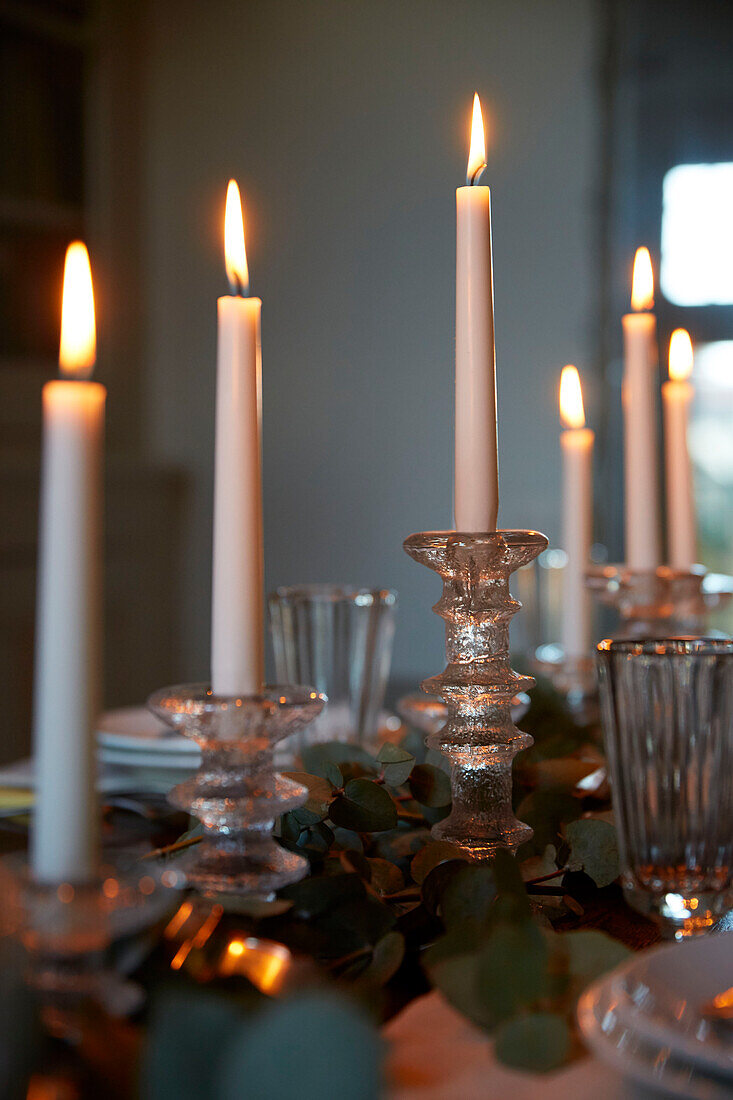 Lit candles on dining table in Rochester  Kent  UK