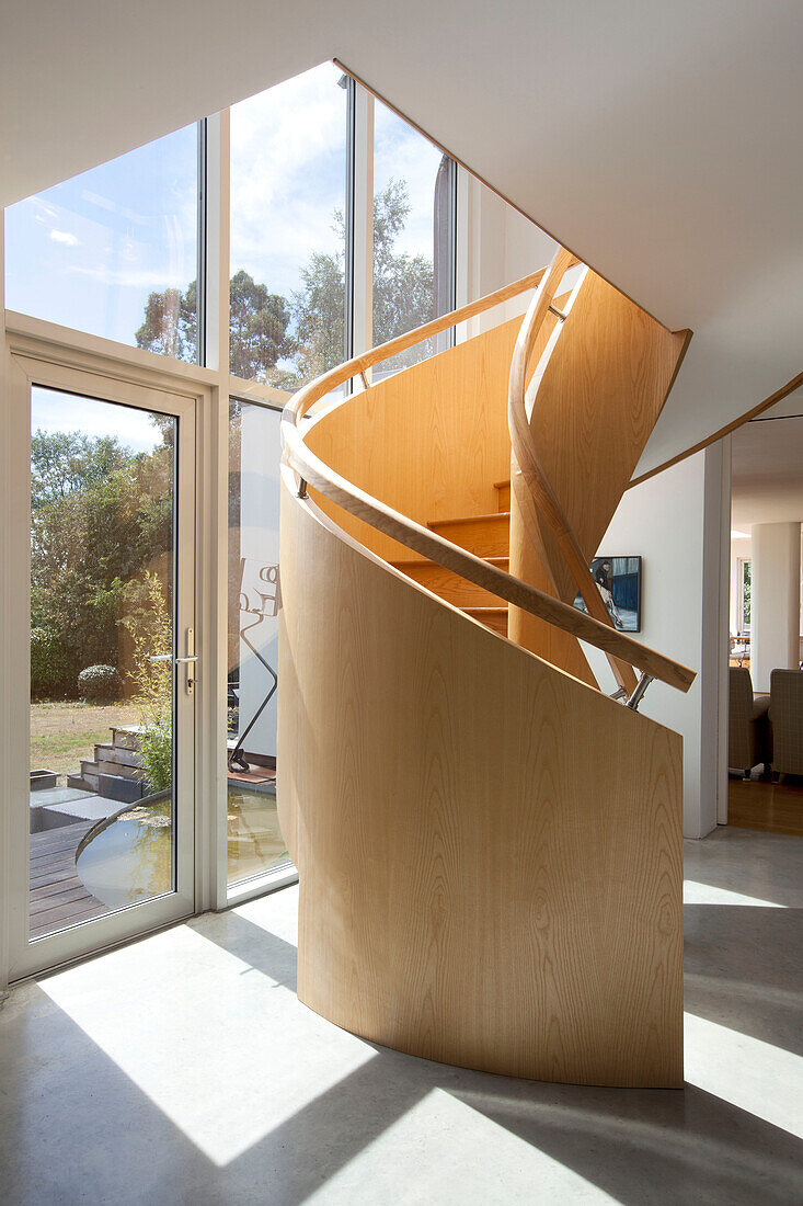 Sunlit double height spiral staircase in Essex home UK