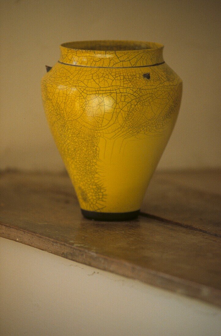 Close up of antique yellow vase