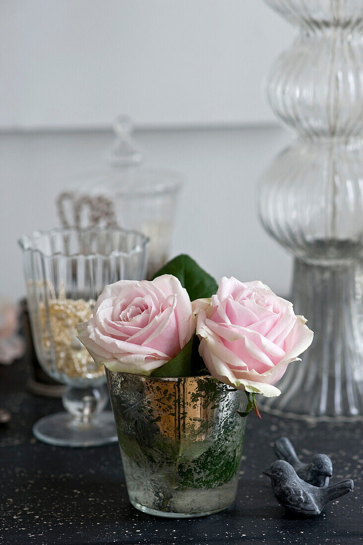 Pink roses in metal vase