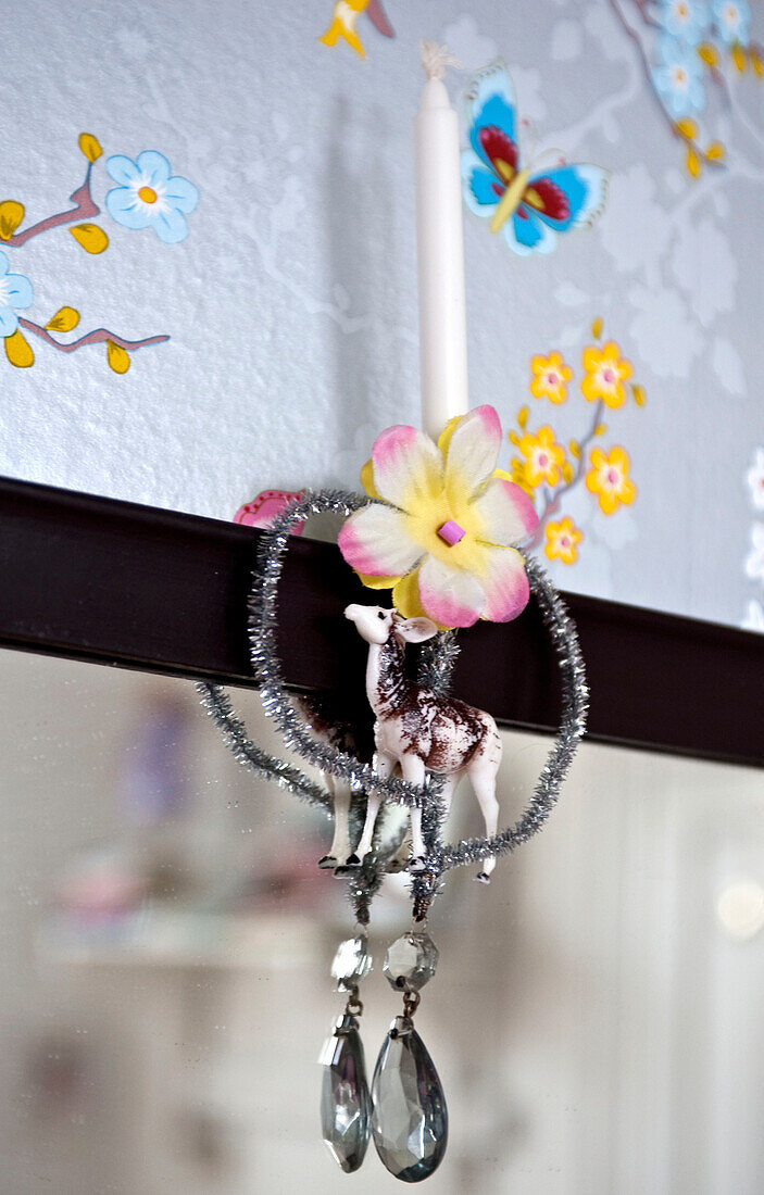 Candle holder and patterned wallpaper in Odense home