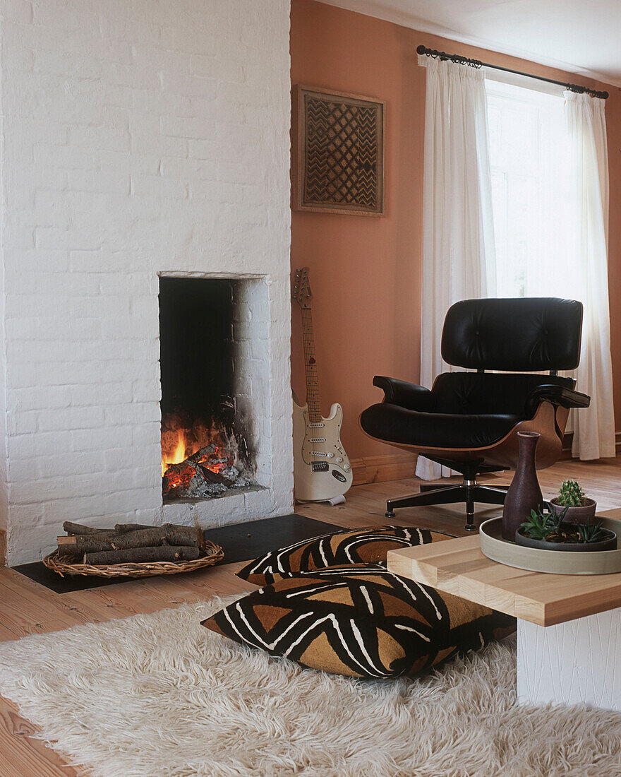 Living room with fireplace and electric guitar