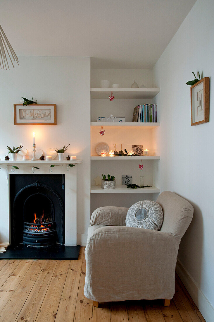 Living room with recessed shelving and original fireplace in Richmond-on-Thames London