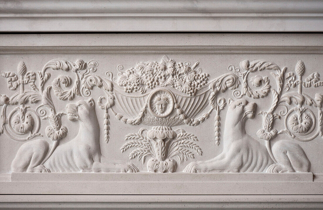 Cornucopia and female lions carved into marble fireplace in historic Yeovil Somerset, England, UK