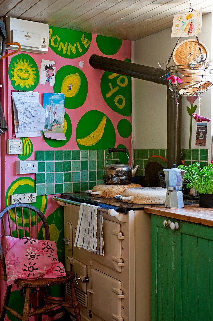 Range oven in pink and green kitchen detail UK