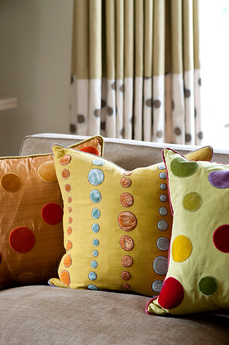 Assorted cushions in West London townhouse England UK