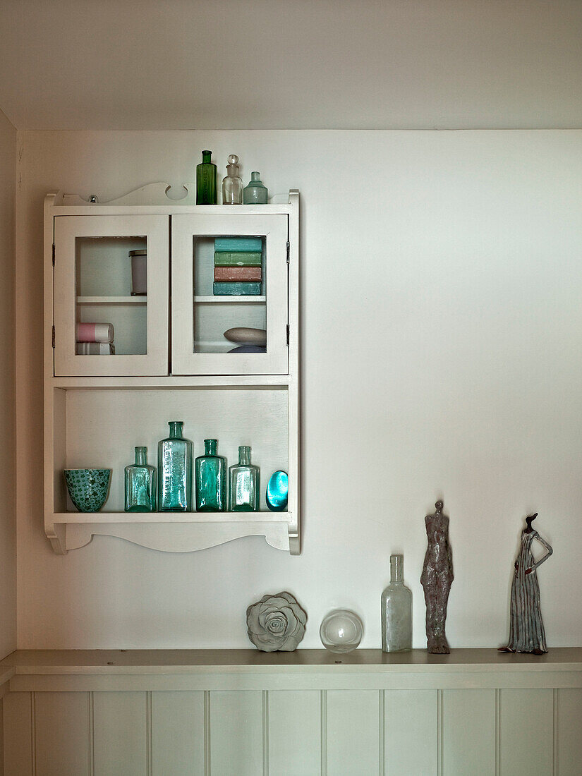 Wall mounted bathroom cabinet in Suffolk family home England UK