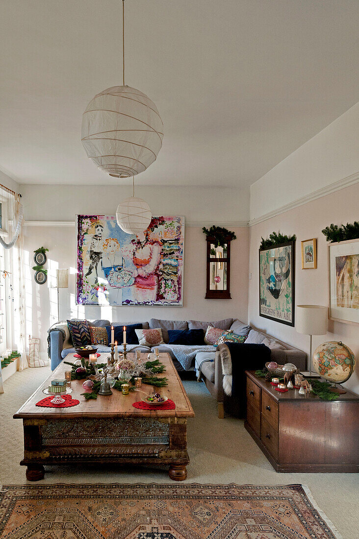Floral garlands on artwork in living room of Forest Row home, Sussex, England, UK