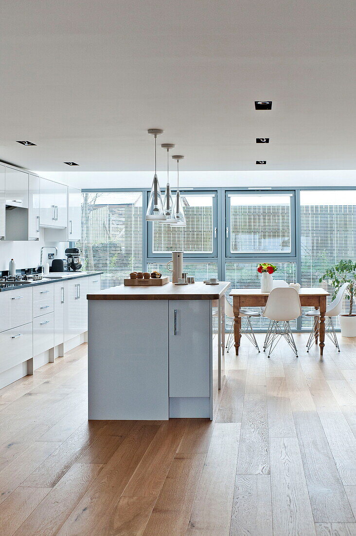 Kitchen island in white fitted kitchen of Wadebridge home, Cornwall, England, UK