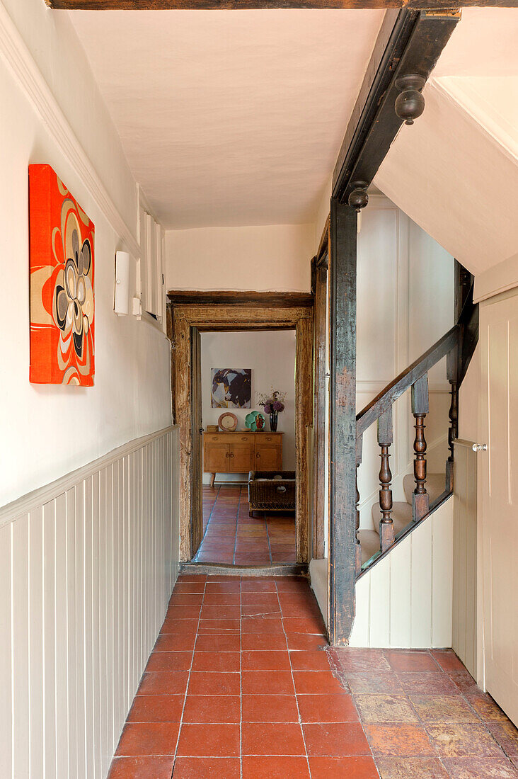 Terracotta flooring in hallway of Hertfordshire home, England, UK