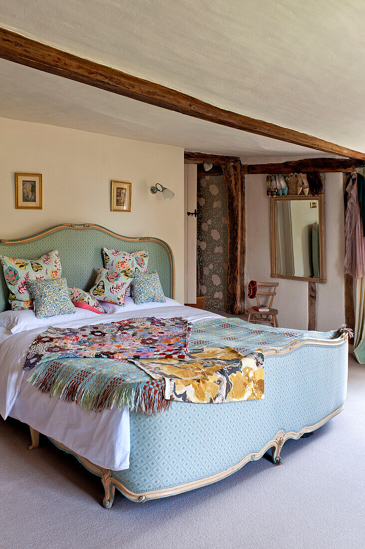 Fabric samples on vintage bed in Hertfordshire home, England, UK