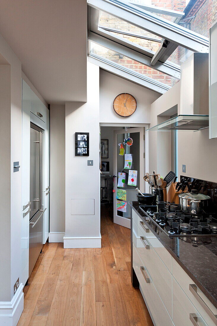 Kitchen with skylight in Middlesex family home, London, England, UK