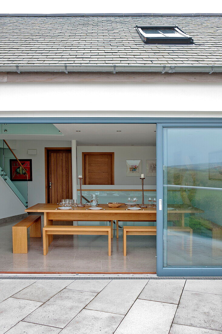 View into dining room of contemporary home, Cornwall, England, UK