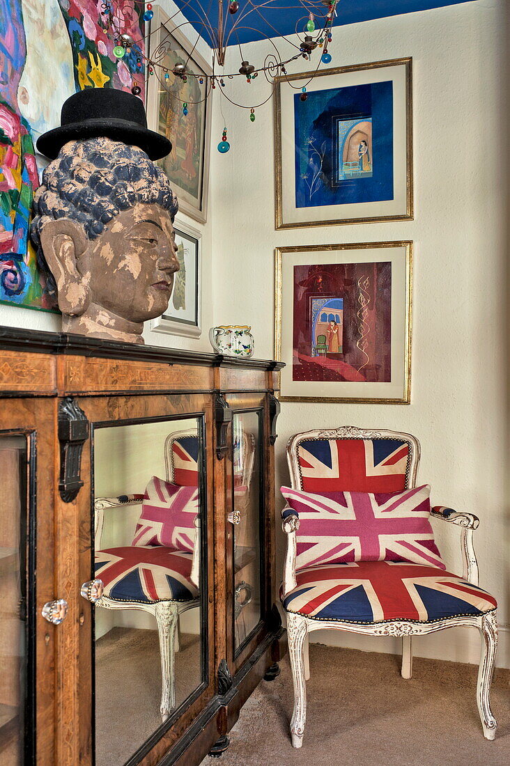 Union Jack chair with display cabinet in London home, England, UK