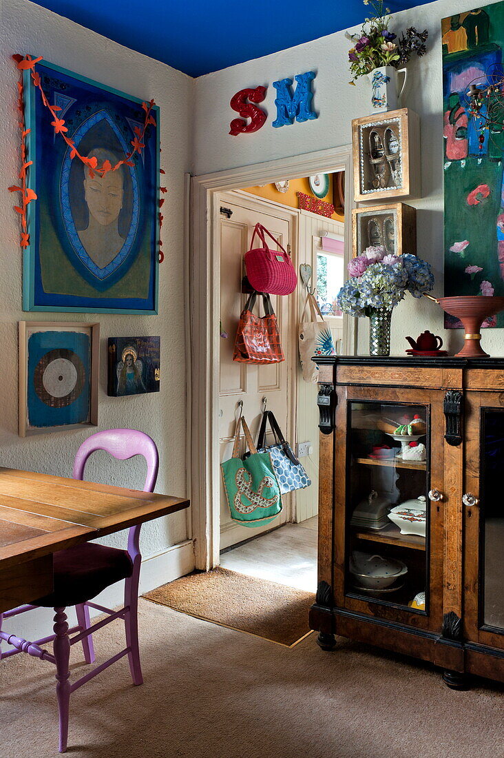 Bags and artwork displayed in London home, England, UK