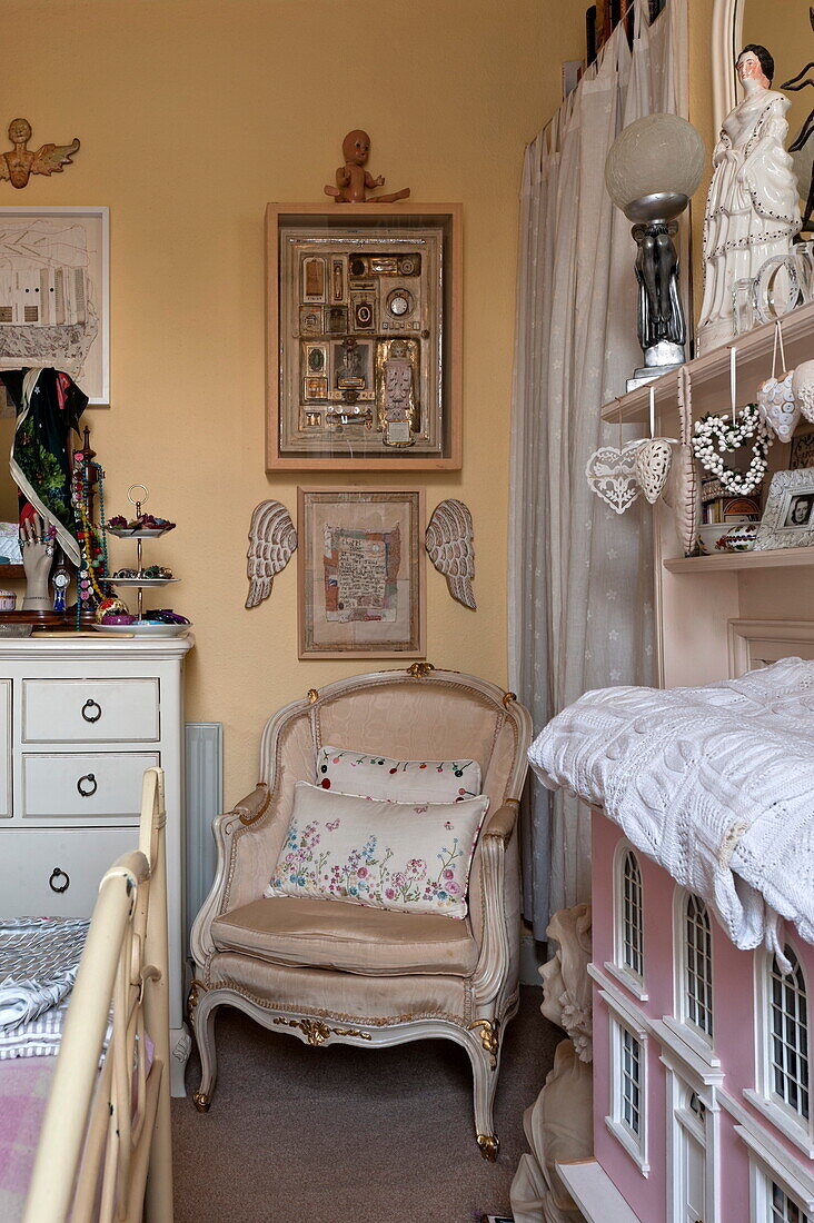 Antique chair and ornaments in bedroom of London home, England, UK