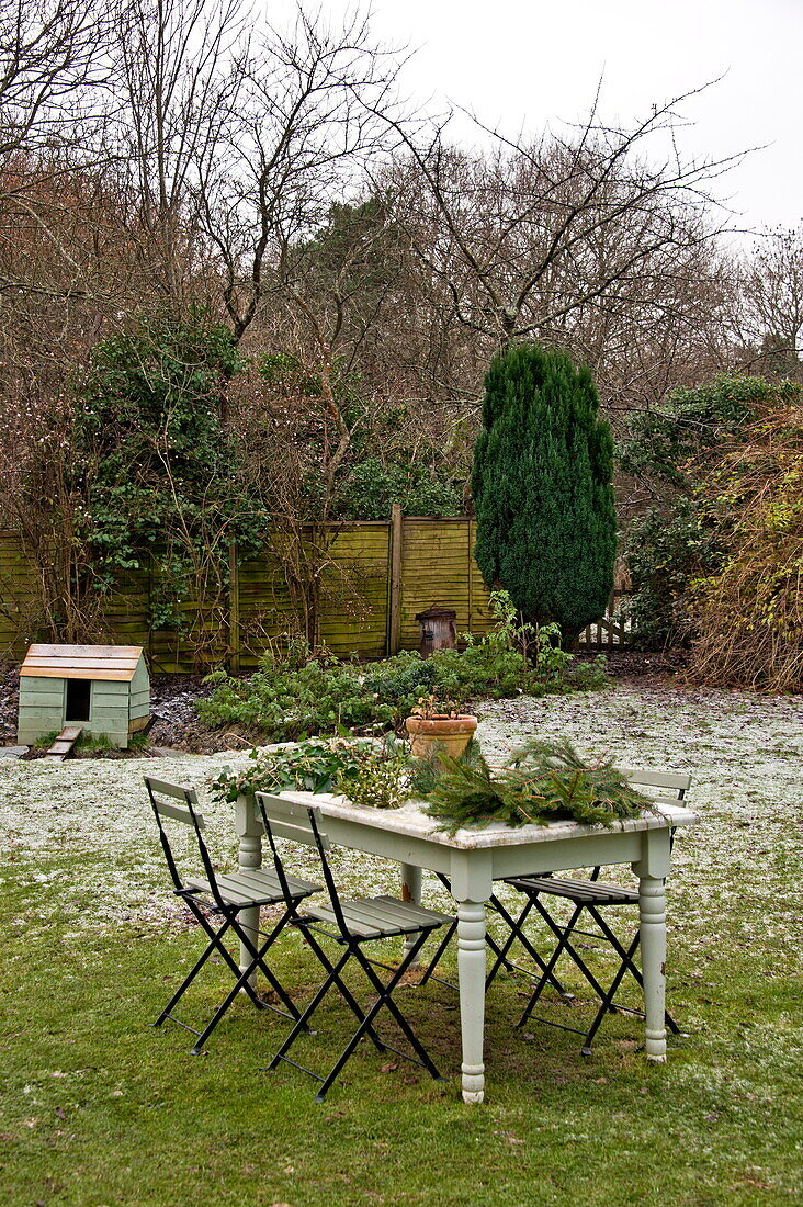 Garden table with cuttings in frost, Shropshire, England, UK