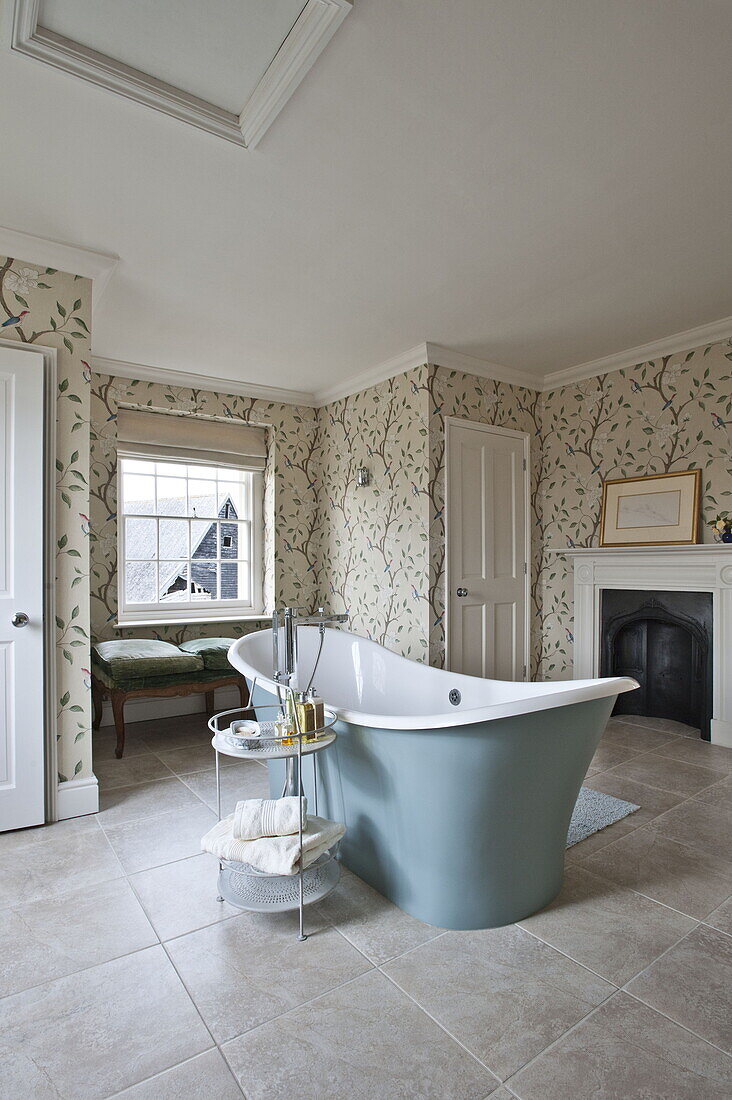 Freestanding rolltop bath in contemporary Suffolk country house, England, UK