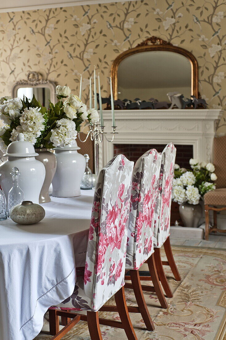 Upholstered dining chairs at table in Bury St Edmunds country home, Suffolk, England, UK