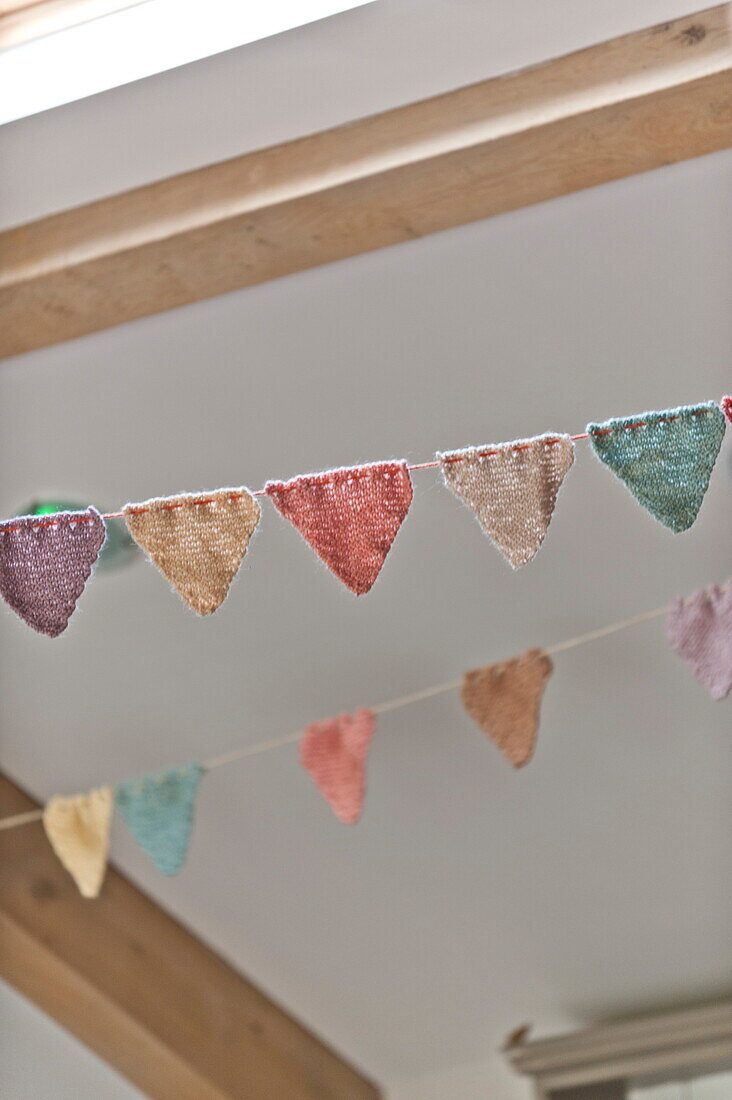 Handmade bunting and ceiling detail in Blagdon home, Somerset, England, UK