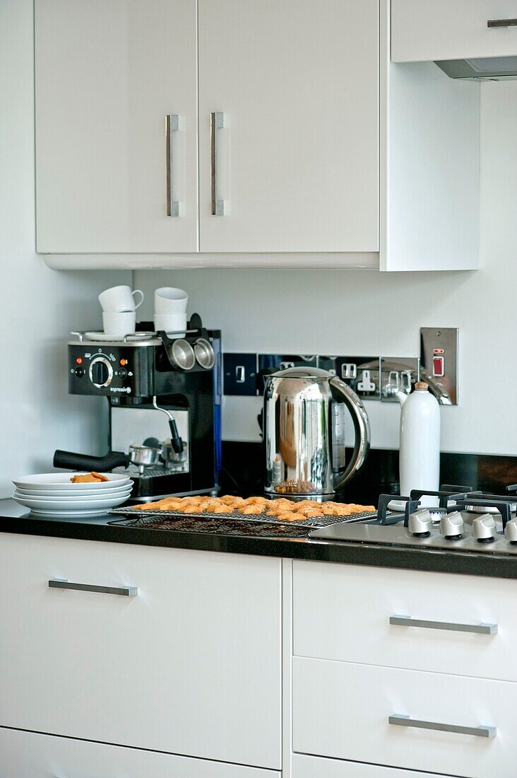 Coffee machine and kettle with baking on tray in kitchen of Wadebridge home North Cornwall UK