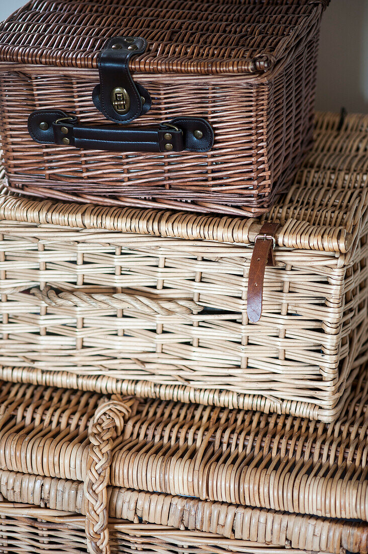 Three wicker storage baskets in Stamford home Lincolnshire England UK