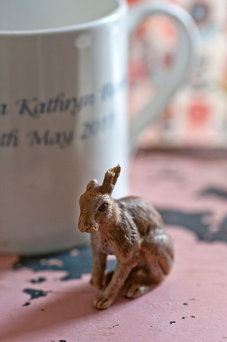 Figurine of a hare with a cup in Cambridge cottage England UK