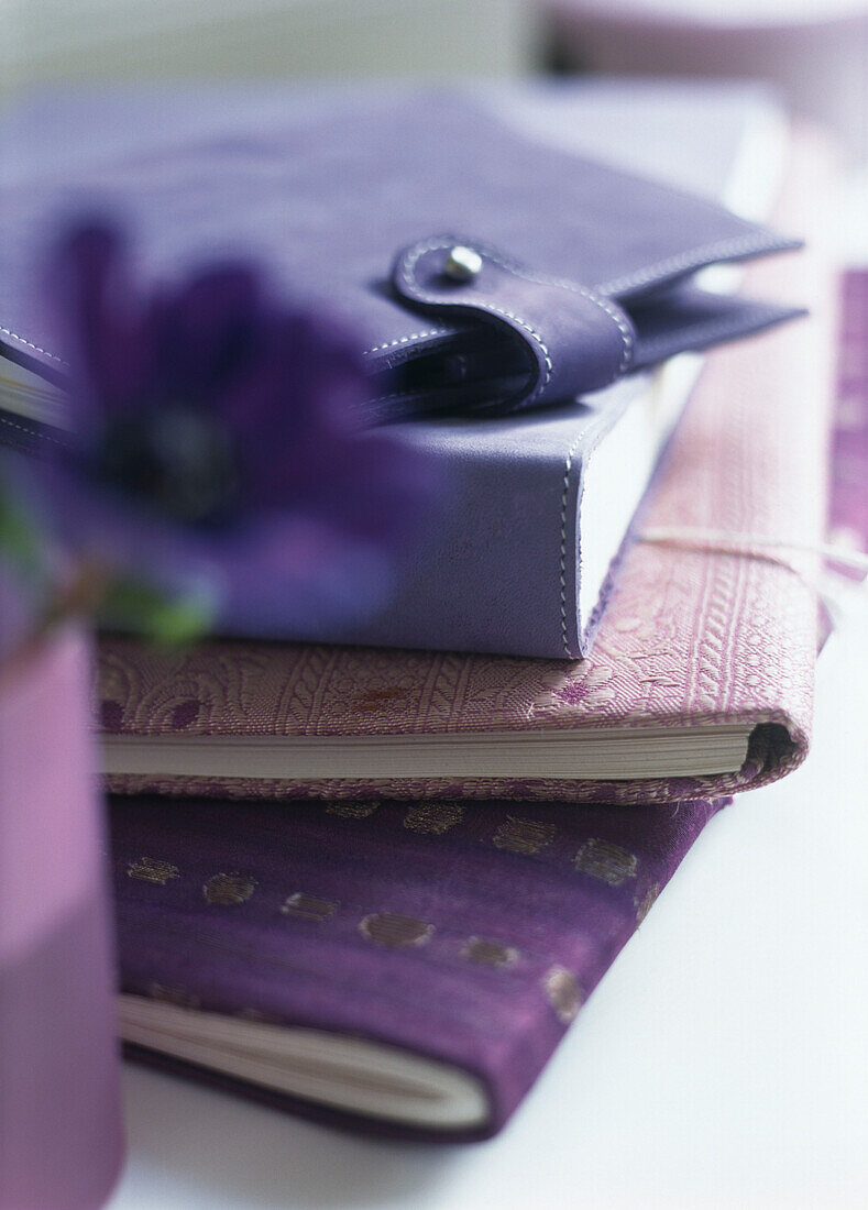 Pile of notebooks in shades of purple