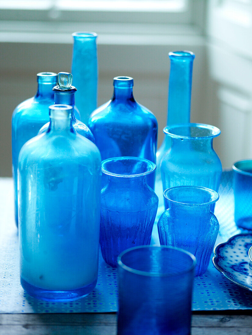 Collection of blue glassware on table