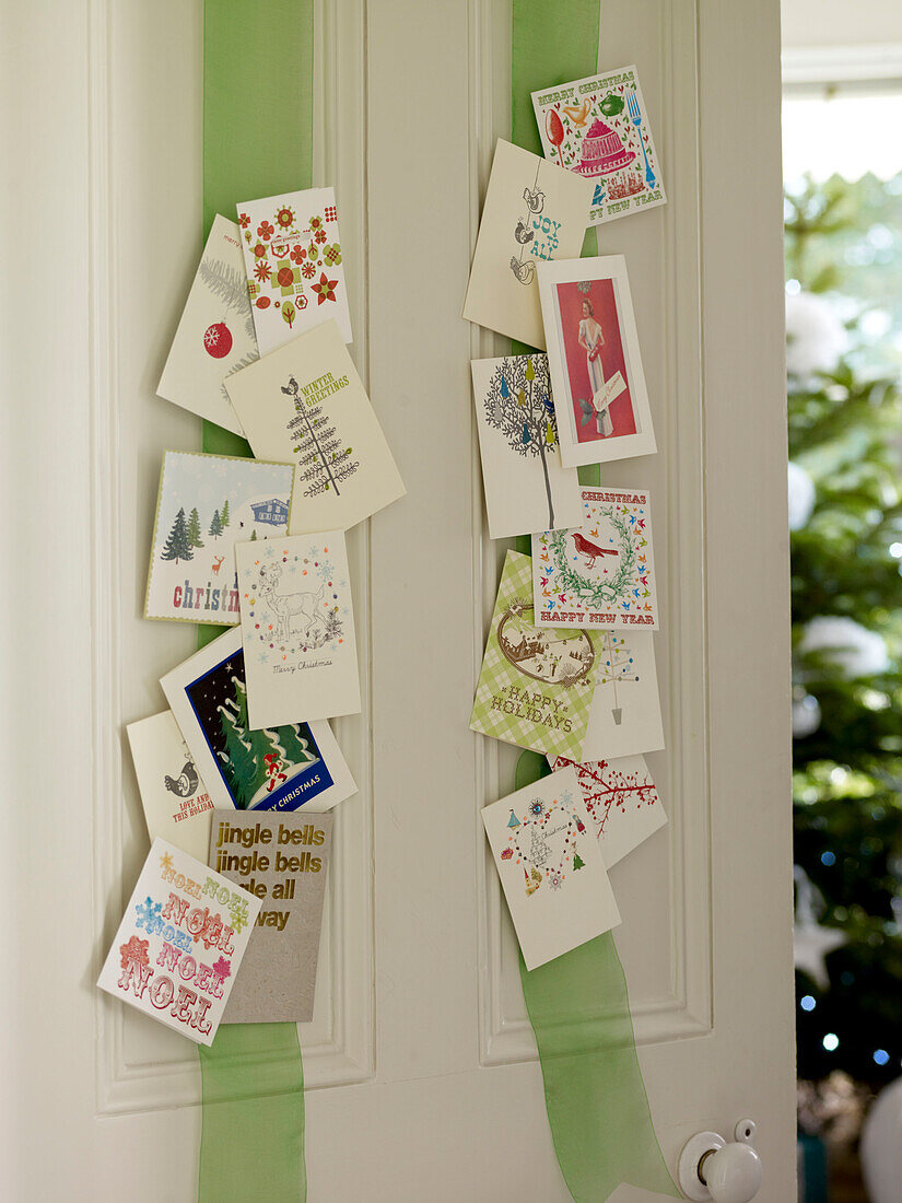 Christmas cards displayed on ribbon