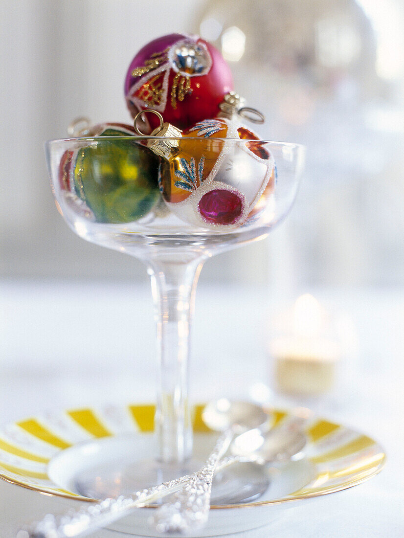 Three baubles in cocktail glass