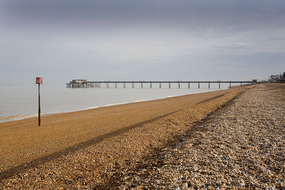 The pier at Deal seafront with shingle beach Kent England UK