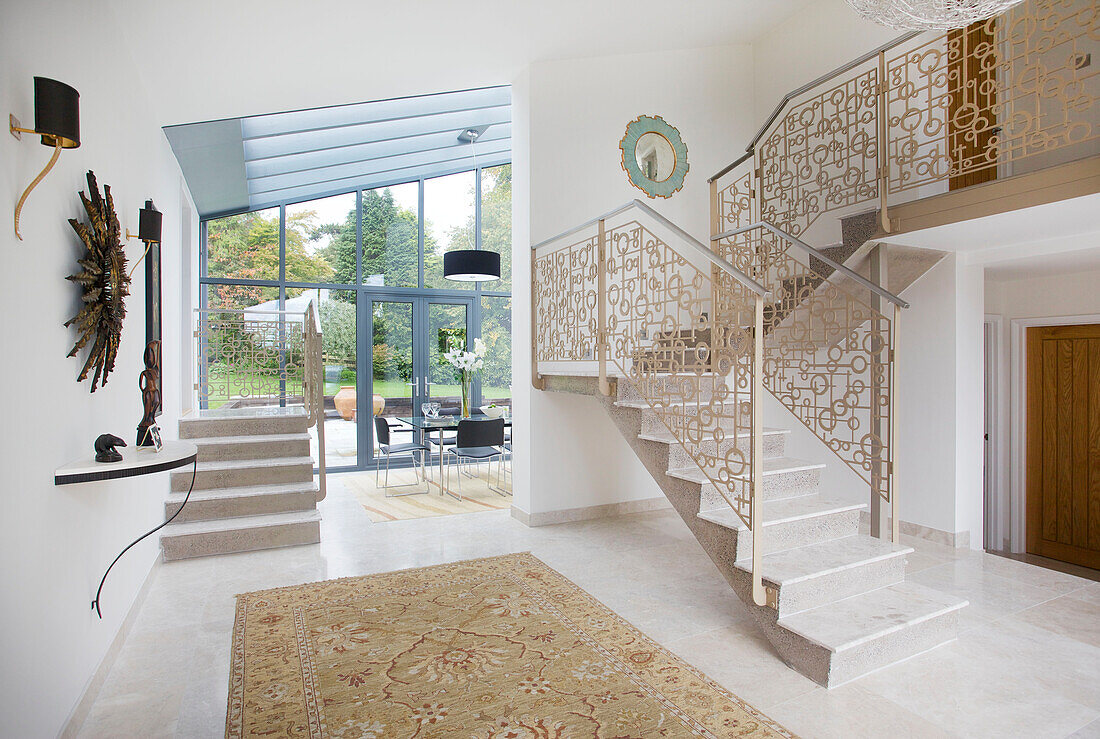 Open plan hallway interior and staircase in modern home Bath Somerset, England, UK