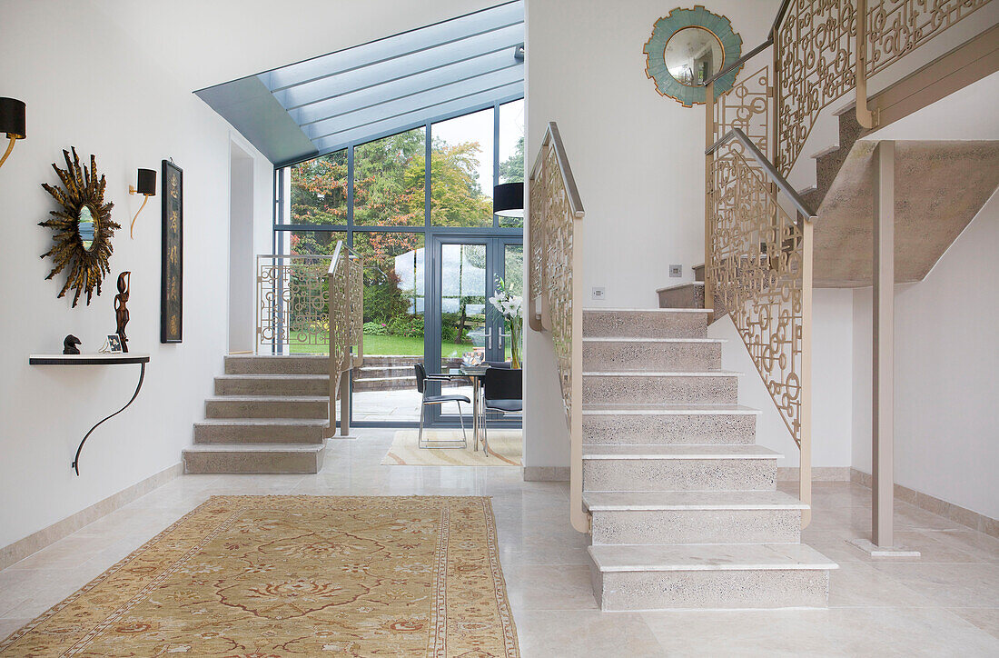 Open plan entrance hall with conservatory extension in modern home Bath Somerset, England, UK