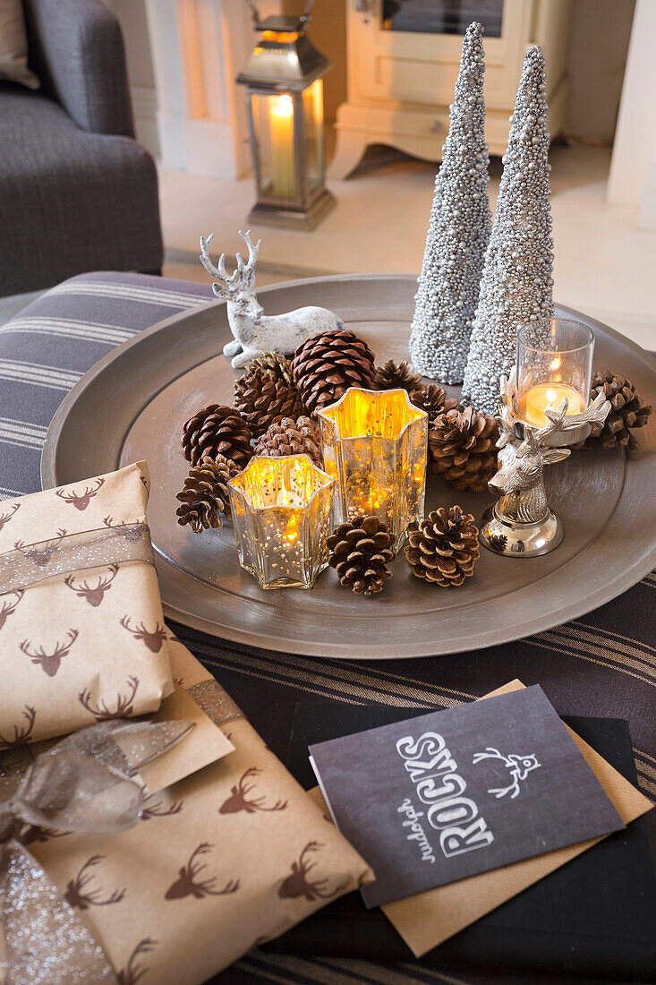 Gift wrapped presents and Christmas decorations in London home UK