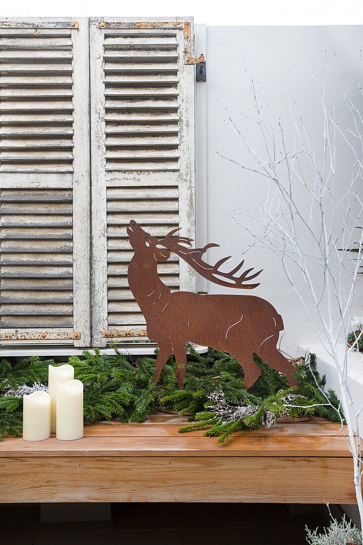 Reindeer ornament and shutters in London home UK