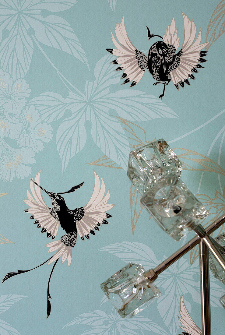 Glass light fitting and Bird of Paradise wallpaper in Cambridgeshire home UK