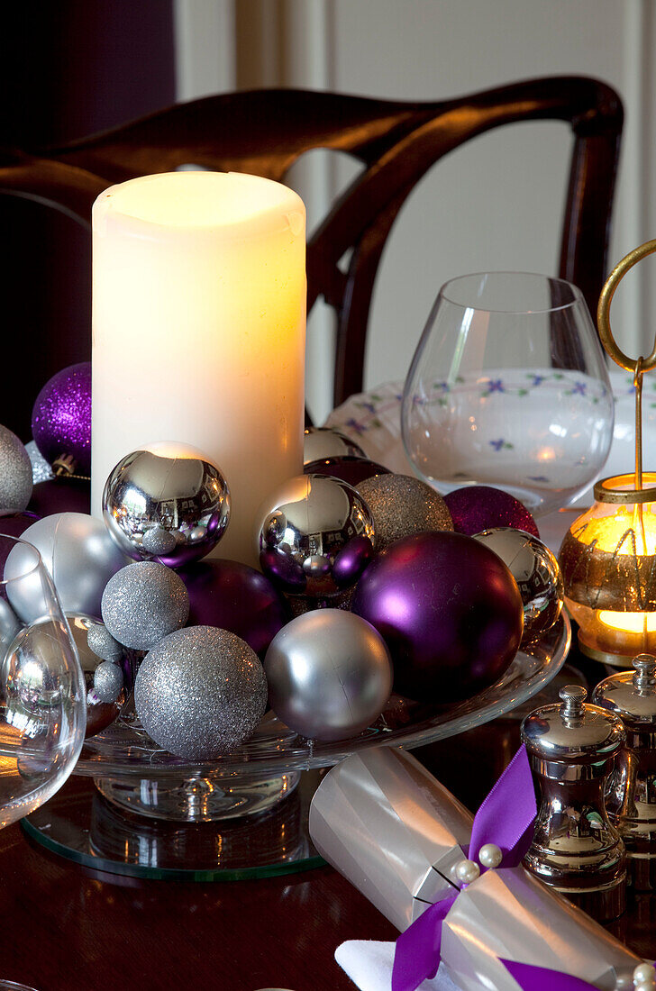 Christmas decorations and candles on a table