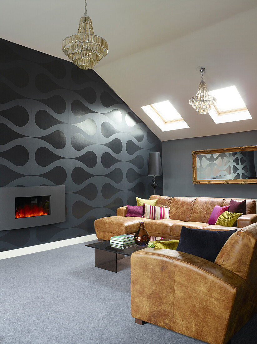 Brown furniture below skylight in room with grey patterned feature wall, Manchester, England, UK